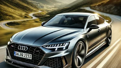 2025 Audi RS7 driving on a scenic mountain road at sunset.