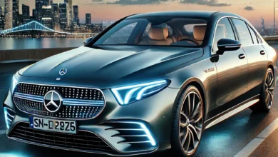 2025 Mercedes-Benz E-Class parked on a scenic road with a sleek design, LED headlights, and a modern city skyline in the background.