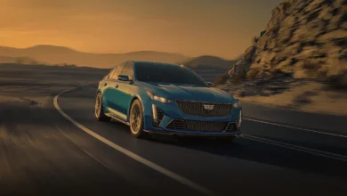 2025 Cadillac CT5-V Blackwing on a highway, showcasing its sleek design and performance.